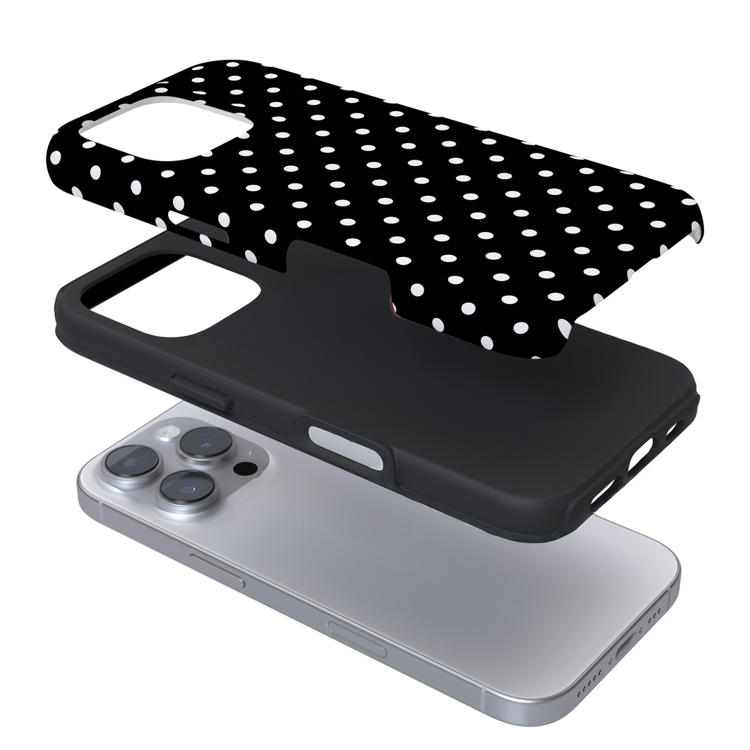 Expanded phone case with black and white polka dots on a white background