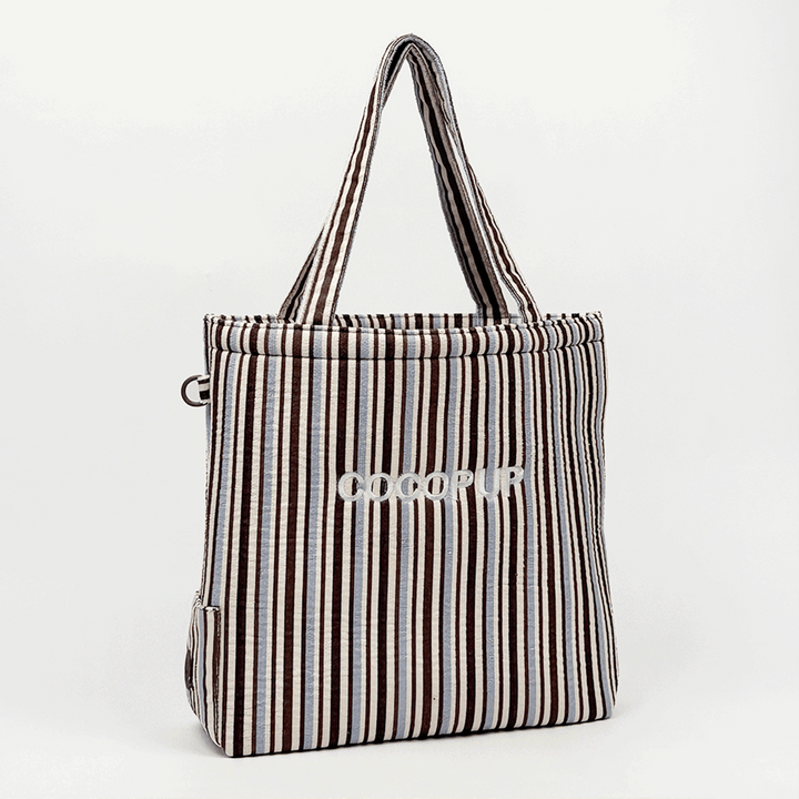 Brown, white and blue striped Tote Bag with poop bag dispenser and D-Ring on side.