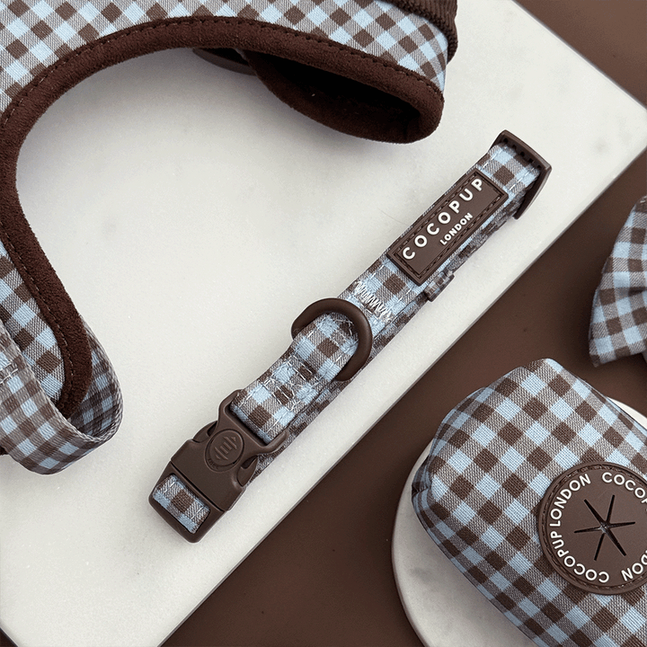 A brown and blue check print dog collar. With brown hardware.