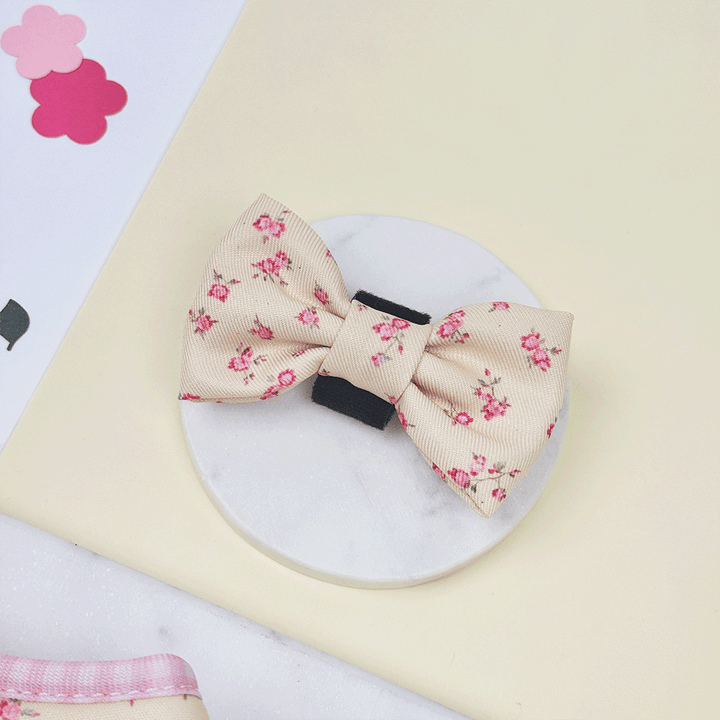 Floral Dog Bow Tie with yellow background and pink flowers.