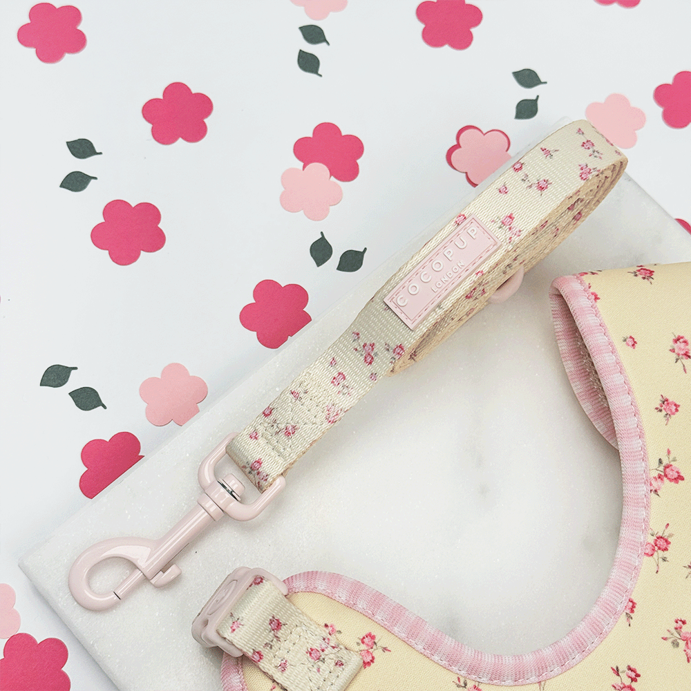 Floral Dog Lead with yellow background and pink flowers.