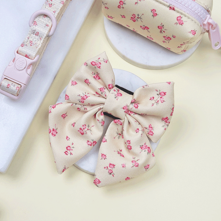 Floral Dog Sailor Bow Tie with yellow background and pink flowers.