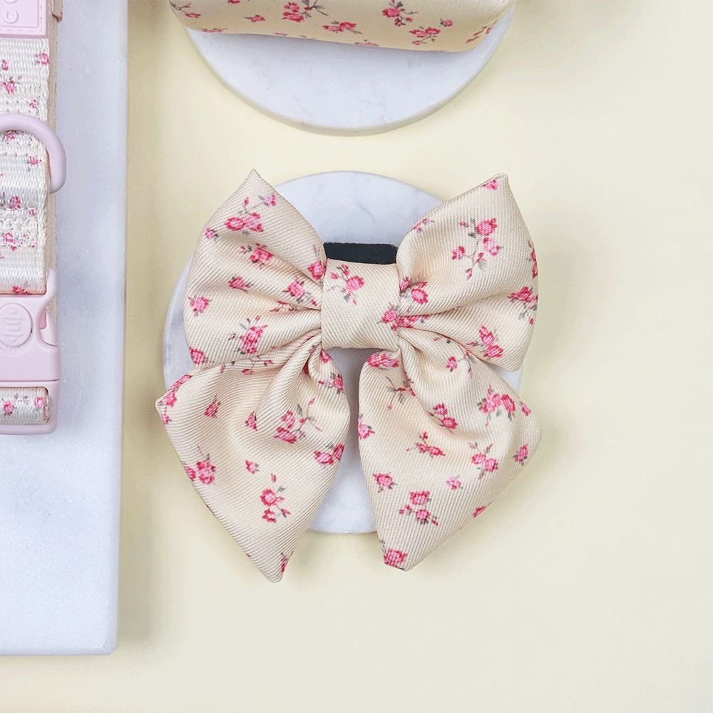 Floral Dog Sailor Bow Tie with yellow background and pink flowers.