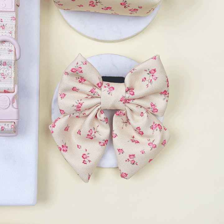 Floral Dog Sailor Bow Tie with yellow background and pink flowers.