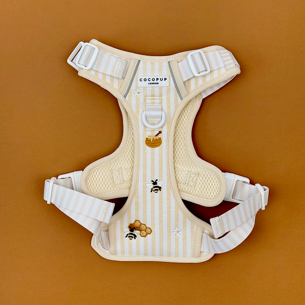 Pale yellow and white striped Dog Harness with embroidered honeycomb and bees, featuring Cocopup Explore logo. 