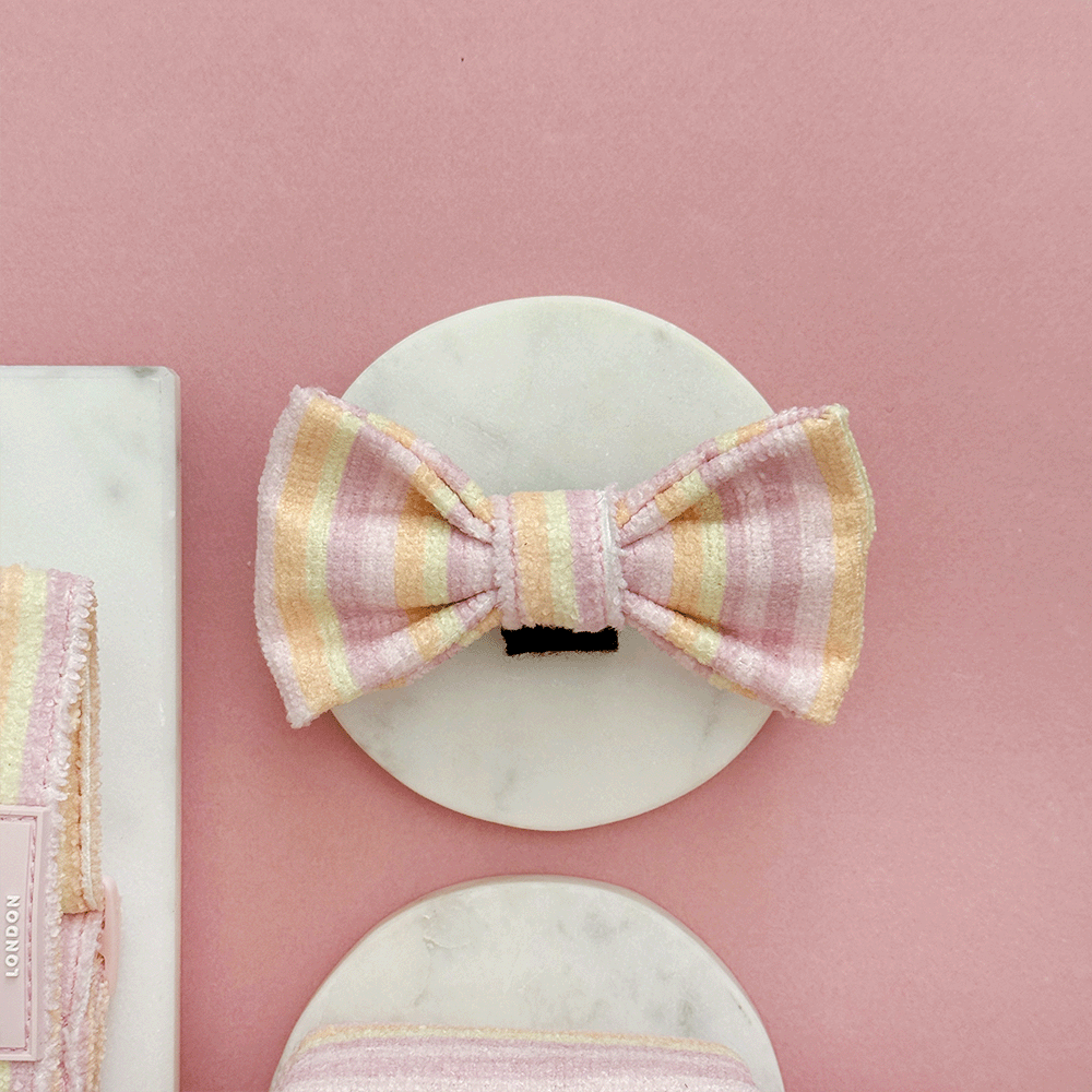 Pink, yellow and orange striped Dog Bow Tie with pink Cocopup logo badge. With velcro fastening.