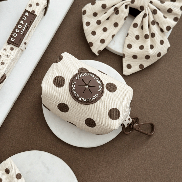 Polka dot product with COCOPUP London branding on a brown surface