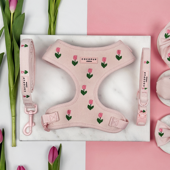 Pink dog harness, lead and collar with tulip embroidery design and Cocopup logo.