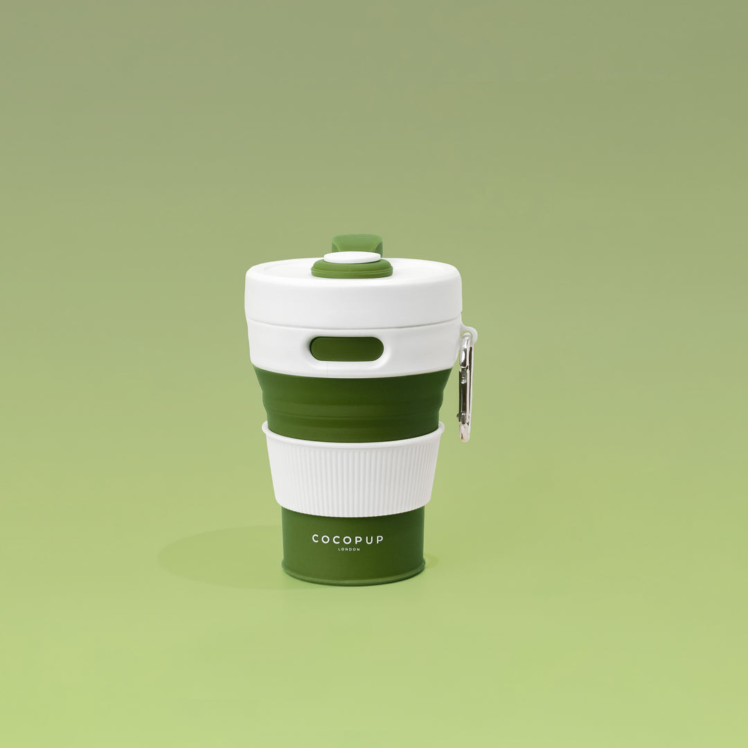 Plain Khaki with White Lid Collapsible Silicone Travel Coffee Cup with Cocopup branding and carabiner clip.