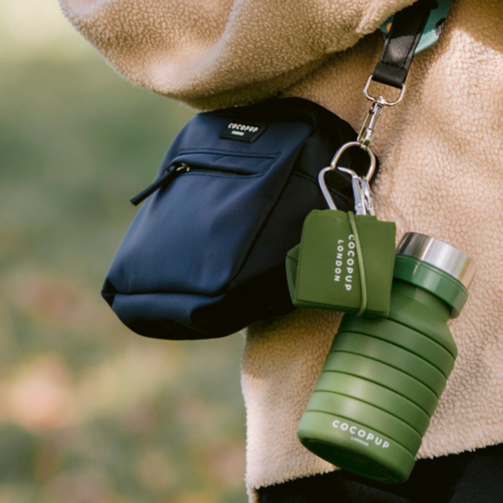 Cocopup Khaki Water Bottle attached to the Cocopup Black Dog Walking Bag alongside the Cocopup Khaki Foldable Bowl.